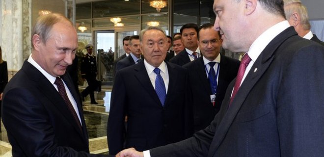 Путин утверждает, что не обсуждал с Порошенко прекращение огня - Фото