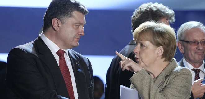 Порошенко и Меркель обсудили нарушение перемирия боевиками - Фото