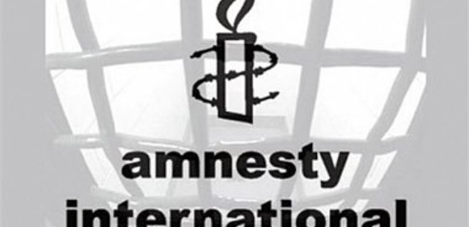 Amnesty International осуждает блокирование конвоев Ахметова - Фото
