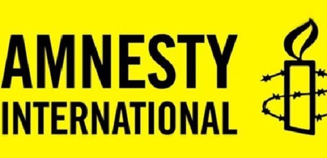 Amnesty International требует расследовать убийства в Донбассе - Фото