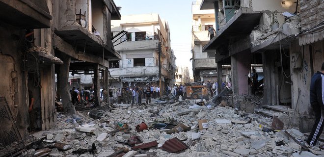 В разрушенный бомбардировками сирийский Хомс возвращаются люди - Фото