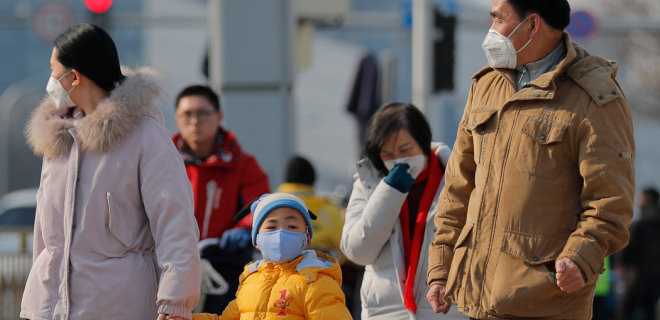 Китай из-за вируса закрывает еще два города  - Фото
