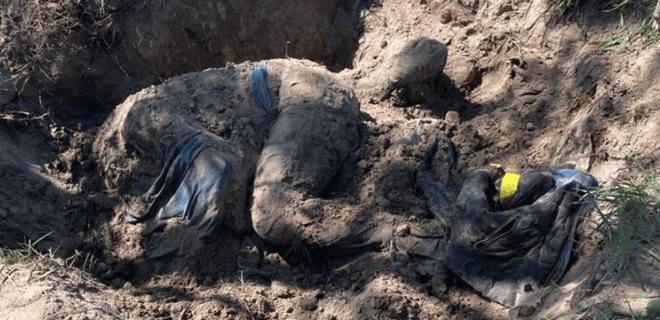 На Київщині знайшли поховання цивільних. Вбиті пострілом у голову - Фото